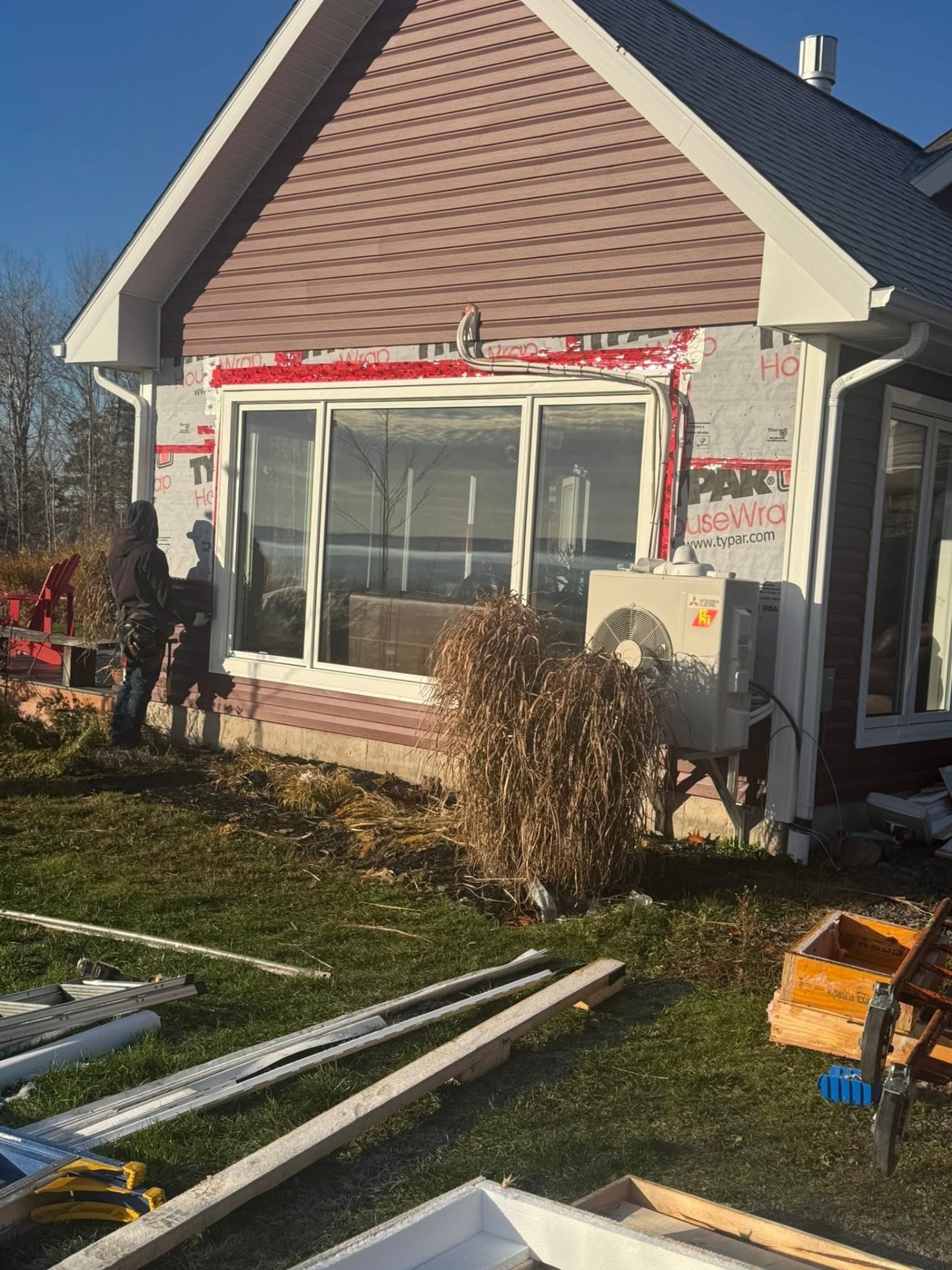 New picture window installed on a gable end during a re-side project