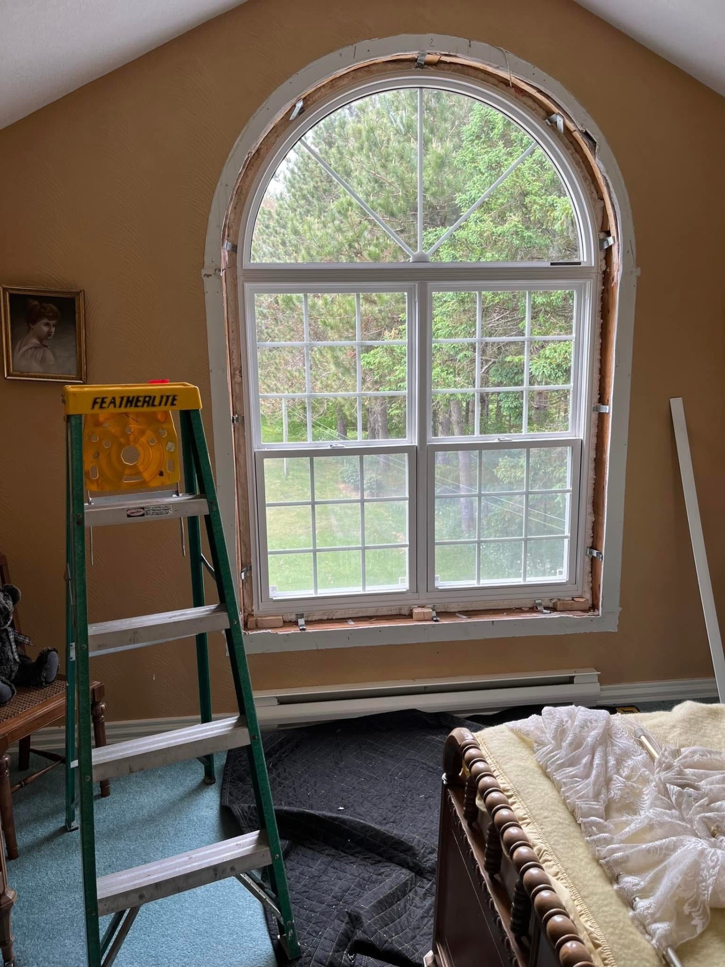 Arched interior window replacement in progress before trim installation