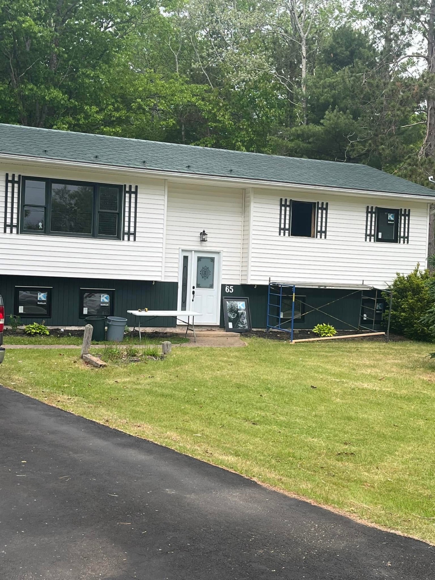 Split-entry home during window replacement with scaffolding in place